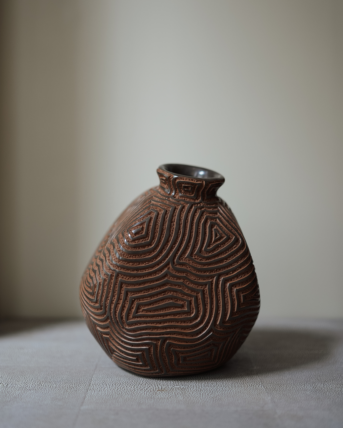 Aradis: handmade Nicaraguan ceramic asymmetric brown vessel carved with concentric maze-like lines