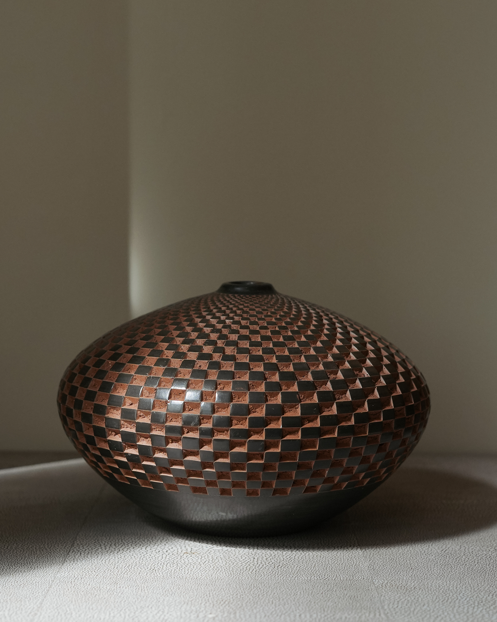 Concepción: handmade Nicaraguan ceramic wide, low vessel with a carved chequered pattern in terracotta and slate grey