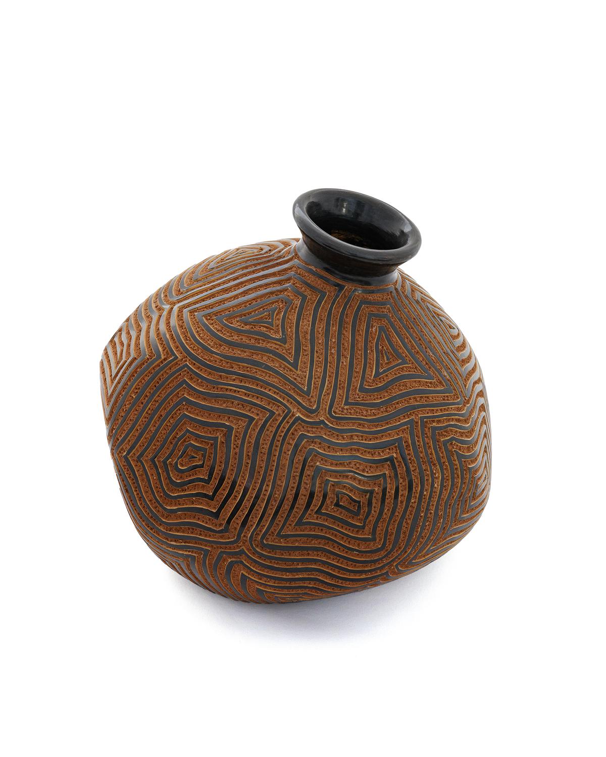 Amaru: handmade Nicaraguan ceramic rounded terracotta vessel carved with concentric maze-like lines and a black glazed neck